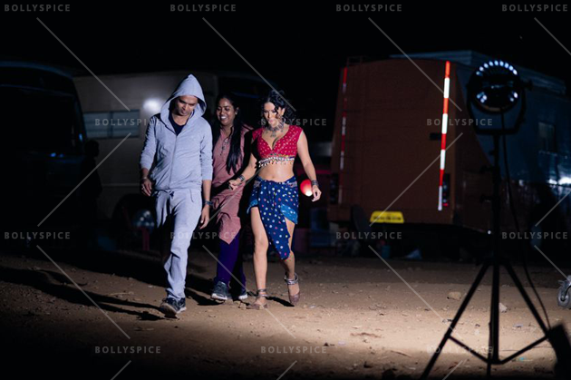 Sunny side up: Sunny Leone being escorted to a shoot at midnight (Ek Paheli Leela)