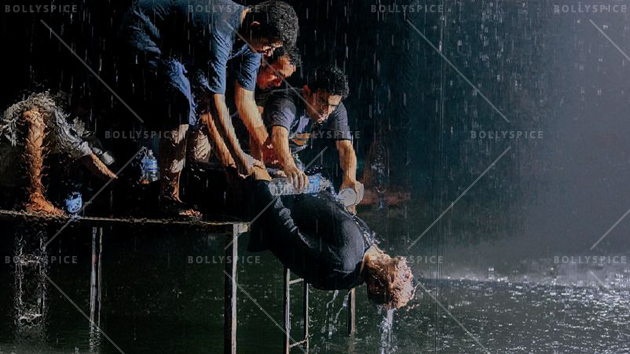  A good drenching: Helpers use bottles of water to create a waterfall effect on the actor (Paap)